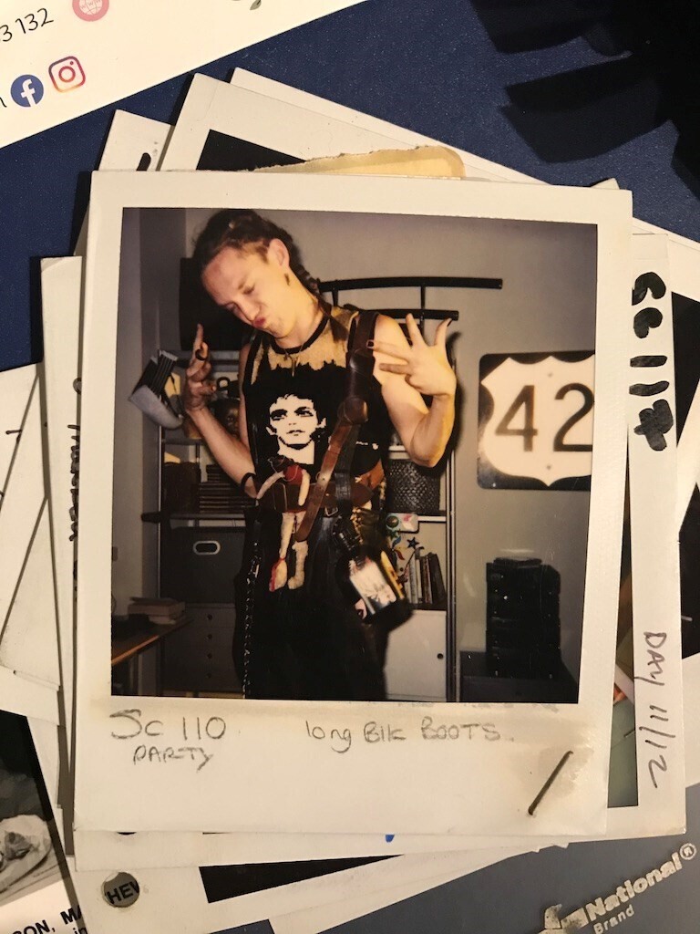 A polaroid photo of Matthew Lillard in an outfit that features a photo of Lou Reed on his chest.