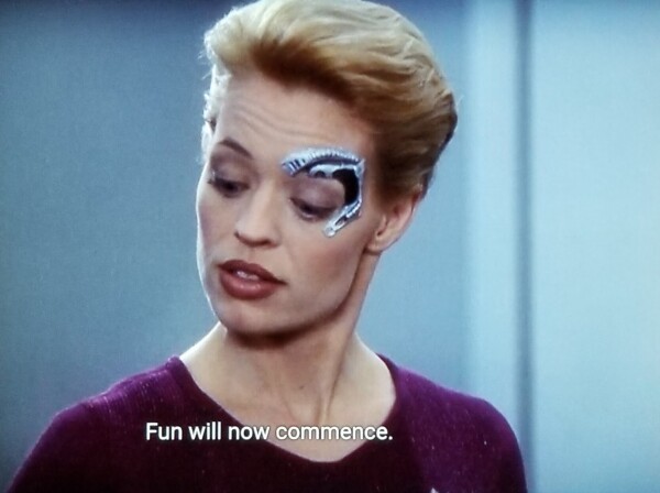 Voyager scene. Seven of Nine (tertiary adjunct of unimatrix 01) is pictured saying, "Fun will now commence."