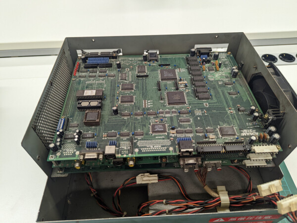 Insides of the Twinkle: three boards, the top one containing the PS1 chips and the I/O boards, the middle one taking care of the video and muxing the DVD signal back into the output, and the bottom one doing all the audio, loading the files from a HDD by itself using a separate MC68k CPU